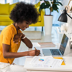 Woman working from home at a desk.